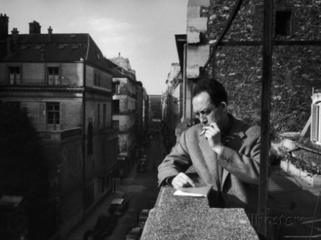 loomis-dean-french-writer-albert-camus-smoking-cigarette-on-balcony-outside-his-publishing-firm-office